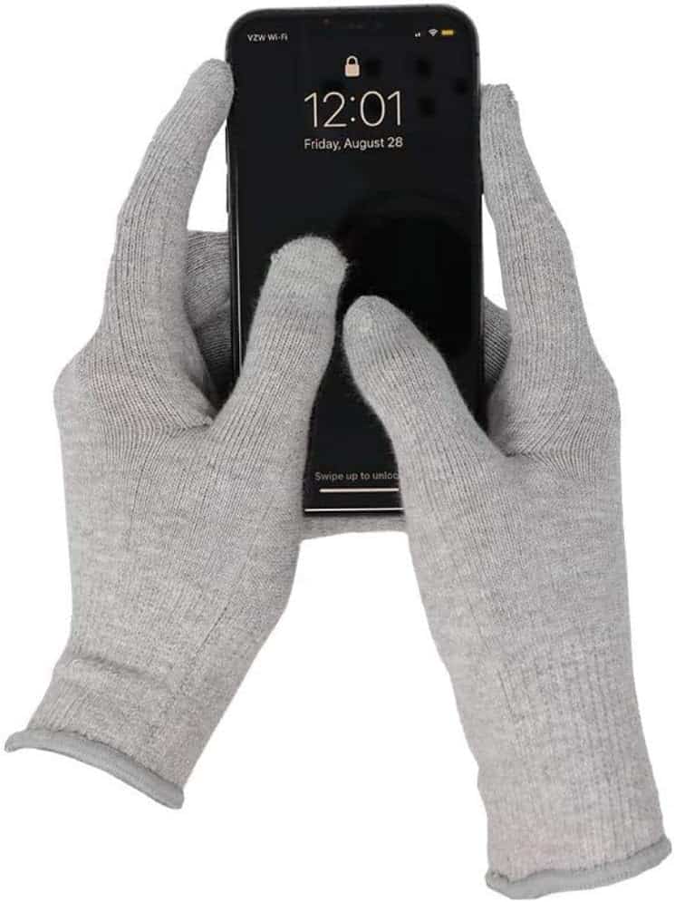Defendershield EMF Protection gloves holding a cell phone.