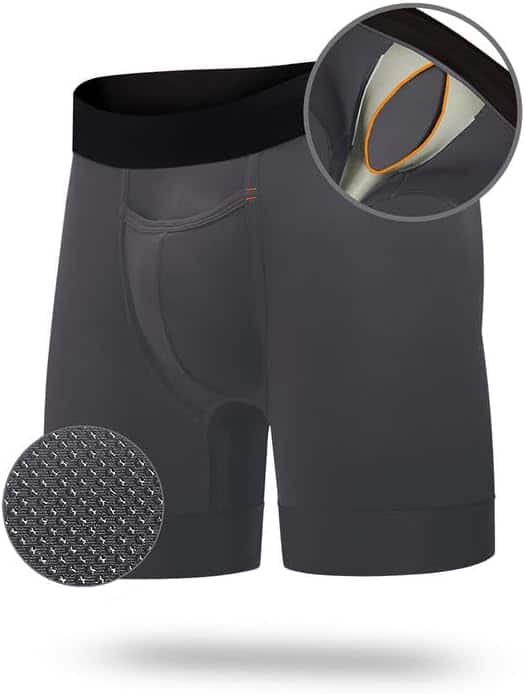 Dark gray mens compression shorts with black waistband. Features include ventilated crotch design and textured fabric close-up.