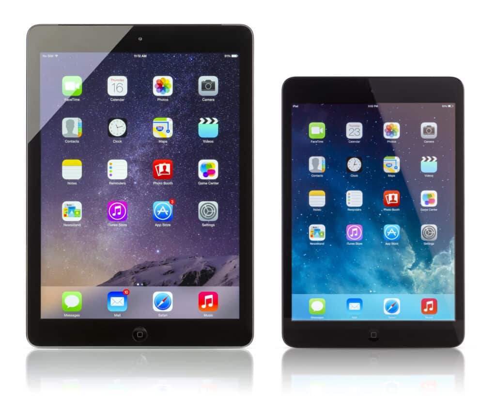 Two black tablets with different screen sizes display app icons on their home screens.