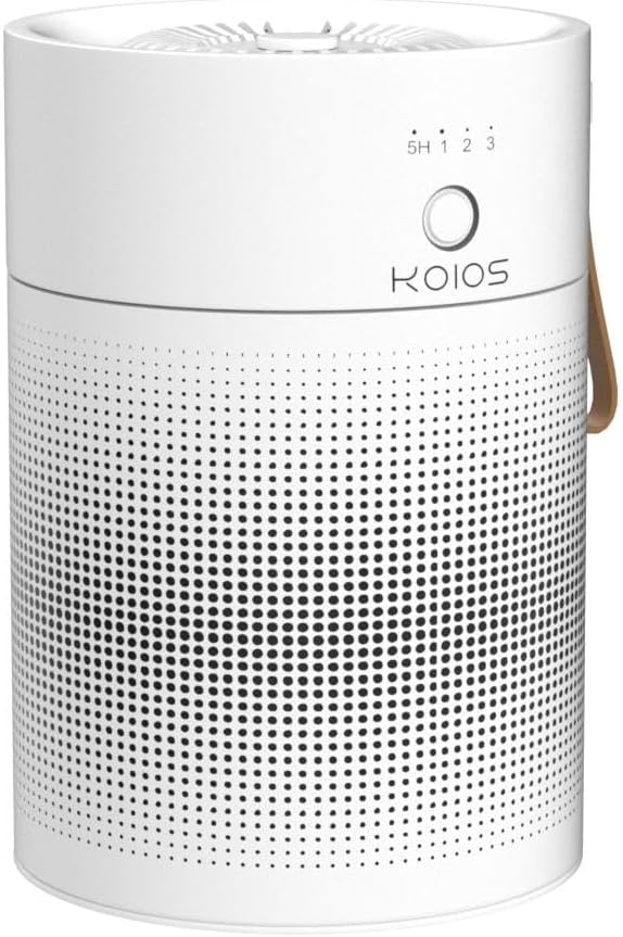 A white cylindrical air purifier with a control panel on top and a small logo that reads Koios on the front.