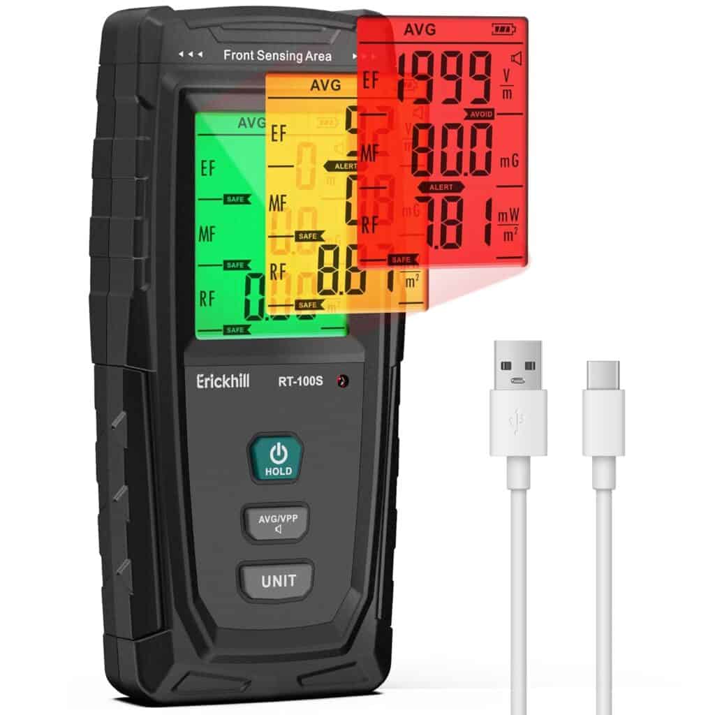 Erickhill100s - EMF Academy A digital EMF meter with a color LCD display showing different readings, next to a USB charging cable. The screen displays green, yellow, and red warning levels.