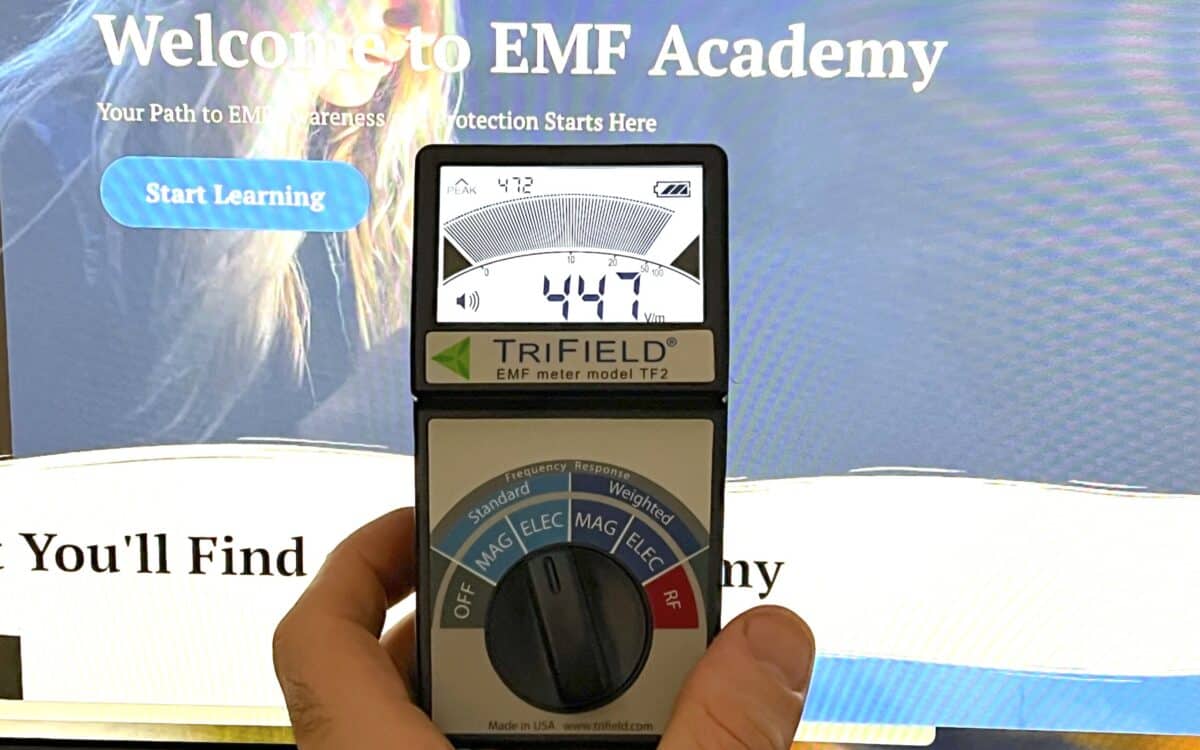 a Trifield TF2 being used to test the EMF radiation levels of a monitor.