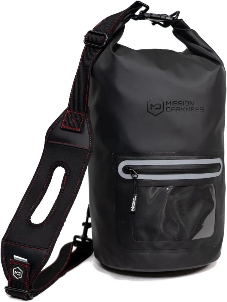 Black dry bag with a transparent front pocket and adjustable shoulder strap, featuring Mission Darkness logo.