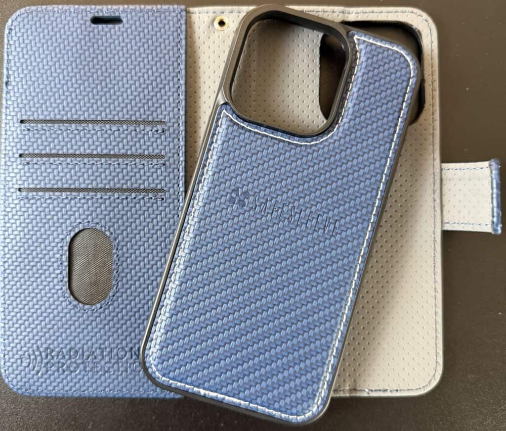Blue textured phone case with a card slot is open on a black surface.