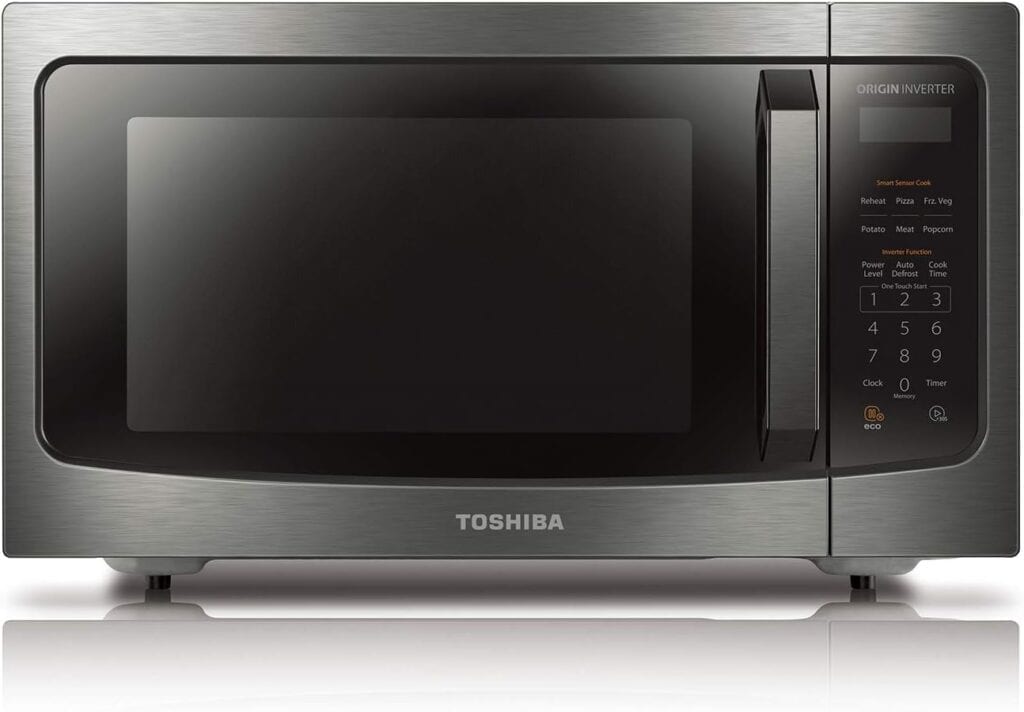 A stainless steel Toshiba microwave with a digital control panel on the right side.