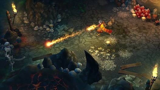 A character in orange robes casts a fire spell in a dark, rocky cave environment lit by torches and glowing crystals.