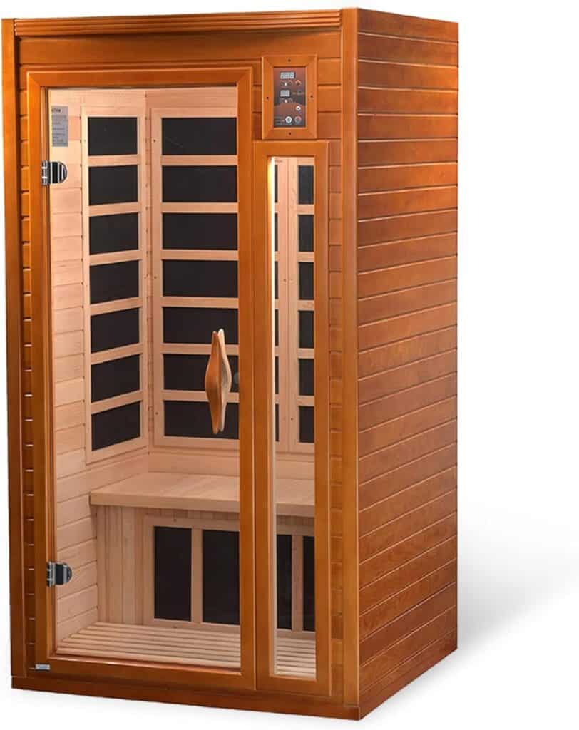 A wooden infrared sauna with a glass door and control panel, featuring interior bench seating and visible heating panels.