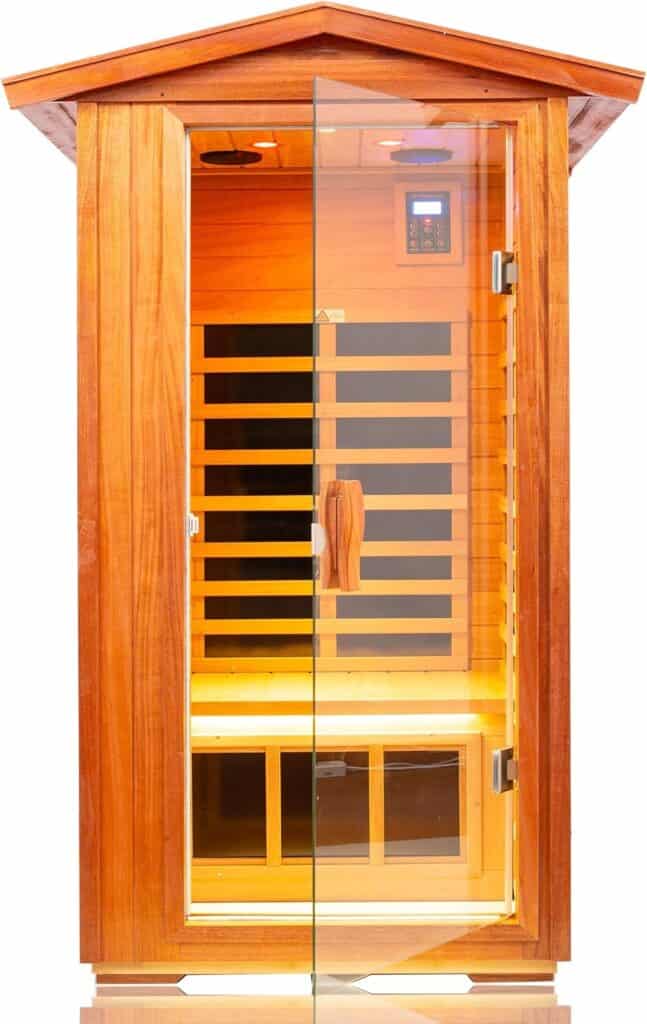 A wooden infrared sauna with a glass door, interior bench seating, control panel, and heating panels is shown against a white background.